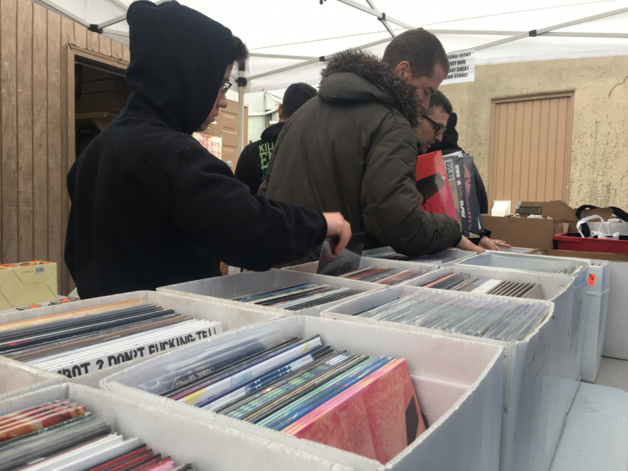 Record collectors dig through the Record Store Day releases at Redscroll.