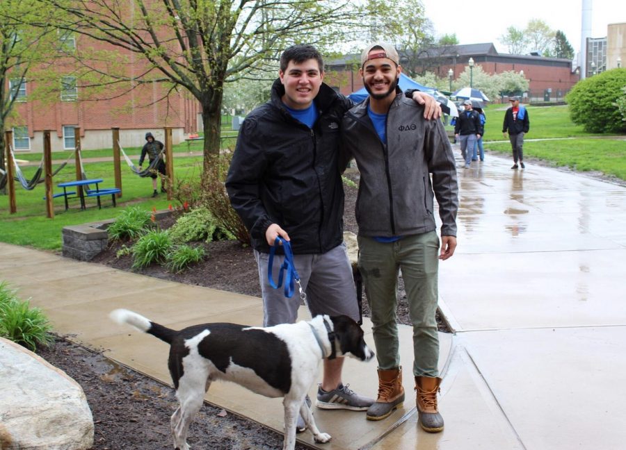 Phi Delta Theta members John Granata, left, and German Rojas, right, walked with dog Archer.