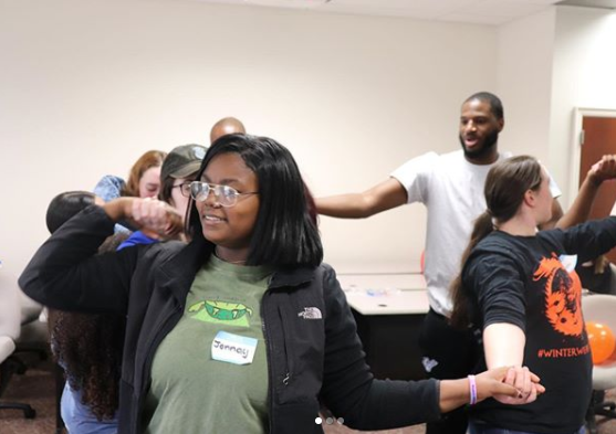 Mentees and mentors attempted to untangle themselves without letting go of each others hands.