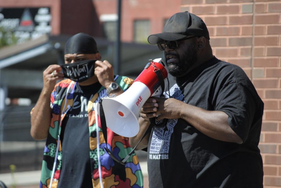 Christopher Dukes stands with his supporters outside of Hartford Police Department sharing his truth.