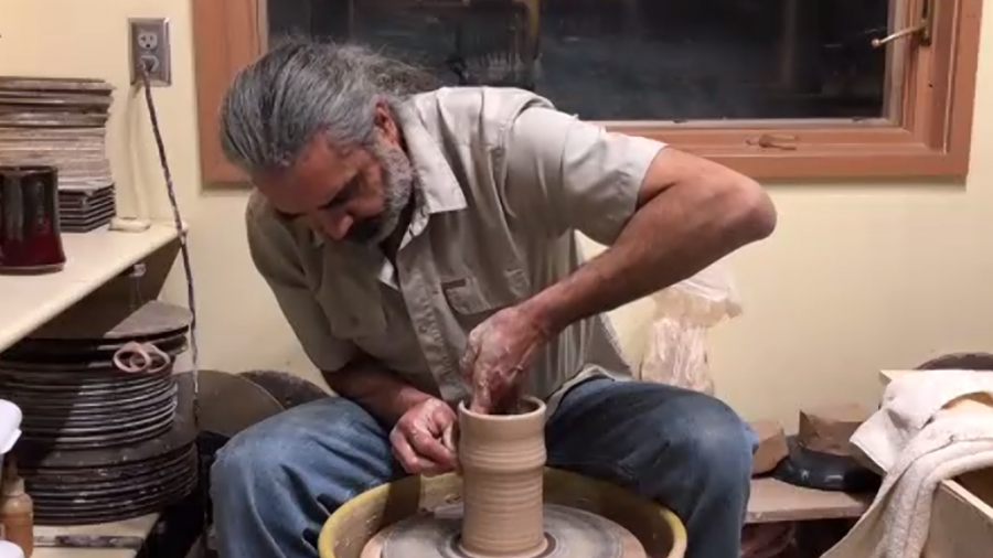 Garcia spins a vase while waiting for the livestream to officially start.