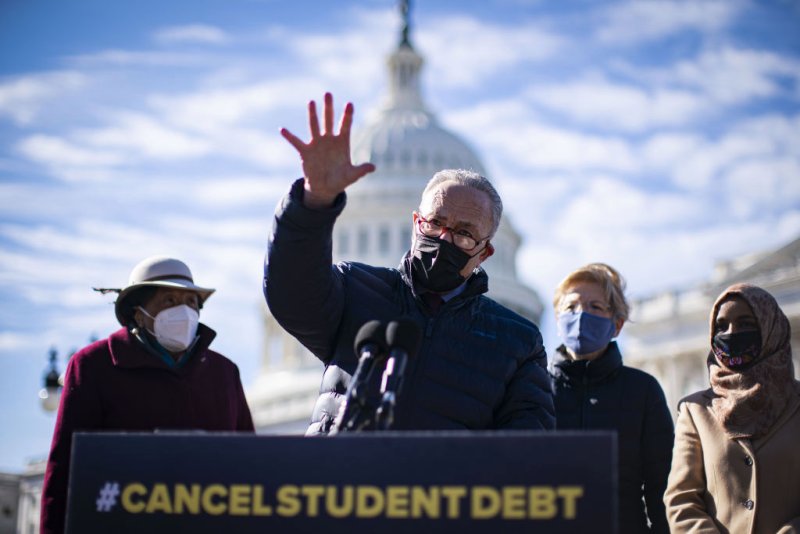 Senate Majority Leader Chuck Schumer, a Democrat from New York, speaks during a news conference on student loan debt in front of the U.S. Capitol in Washington, D.C., U.S., on Thursday, Feb. 4, 2021. House Democrats are heading into a showdown with Republicans today over GOP Representative Marjorie Taylor Greenes past promotion of conspiracies that threatens to provoke an escalating cycle of political retaliation. Photographer: Al Drago/Bloomberg via Getty Images
