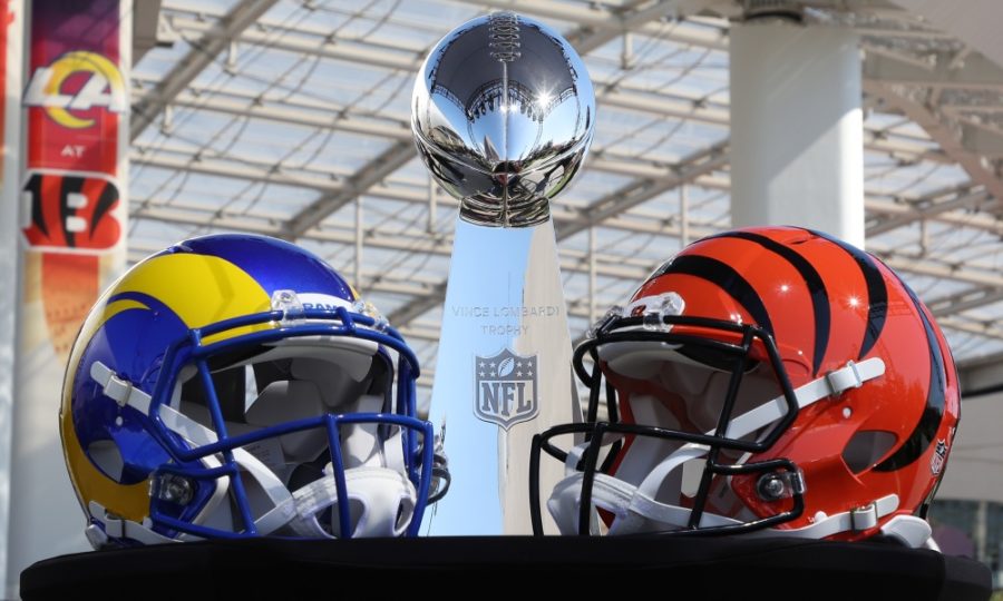 Helmets of the Los Angeles Rams and the Cincinnati Bengals  , accompanied by the Lombardi Trophy, sit on top of a podium during a league press conference at SoFi Stadium on February 9, 2022, prior to Super Bowl LVI.