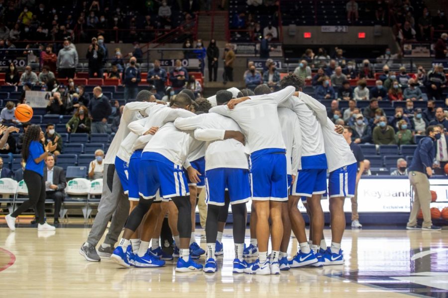 The Central Connecticut State University mens basketball team huddles just before tip-off of the Northeast Conference Tournament quarterfinals game at Bryant University.
