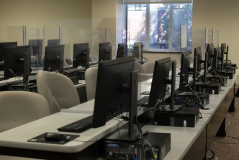 The lower level of Robert C. Vance Academic Center has plastic partitions beside each computer. On April 21, the barriers remained after the mask mandate was lifted.