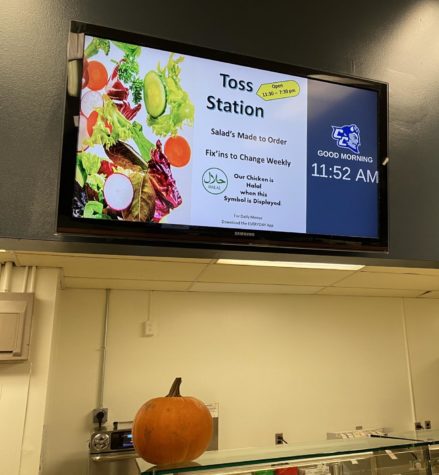 A board featuring the Toss Station at Memorial Hall.