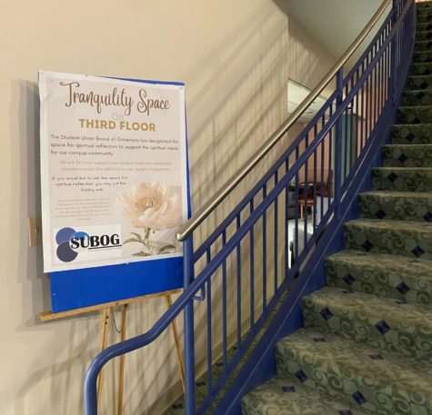 A sign highlighting the Tranquility Space at the bottom of the staircase.