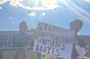 'Abolitionist,' Norman Patterson, held a sign that showed an aborted fetus while pulling the sign of a protestor.