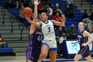 Selina Monestime driving into the paint for a layup during Saturday's 71-59 win over Stonehill.