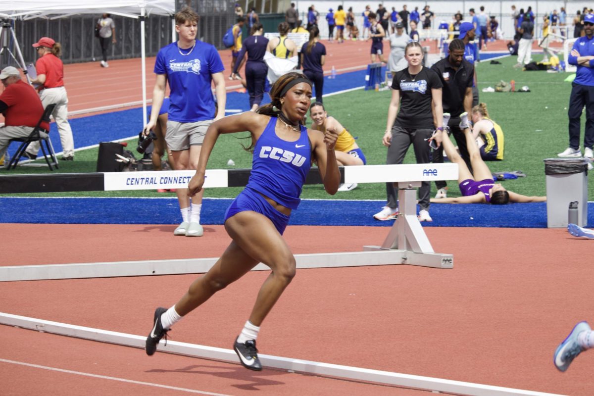 Kyrah Smith files through the south turn at the CCSU track