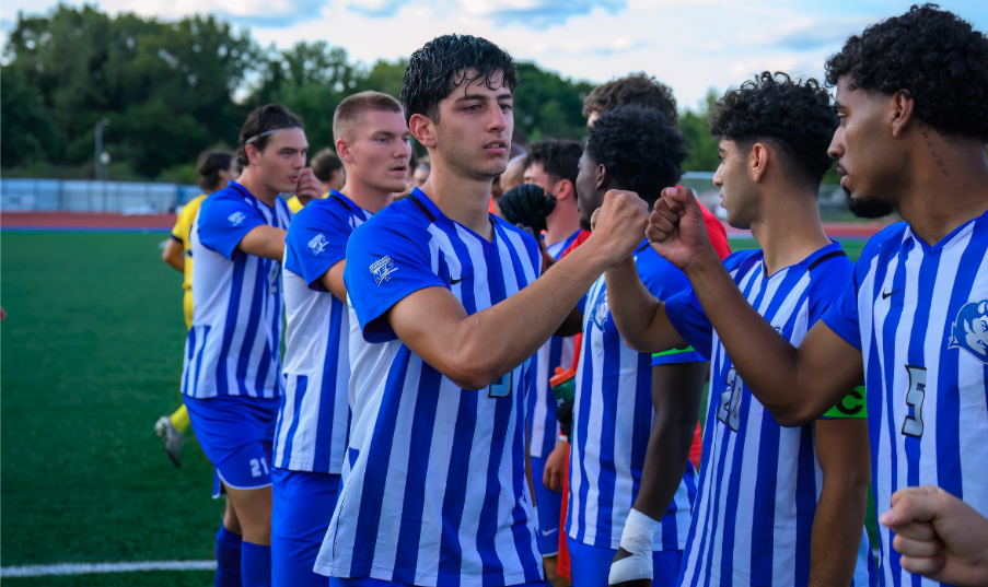 The CCSU men's soccer team concluding their game together