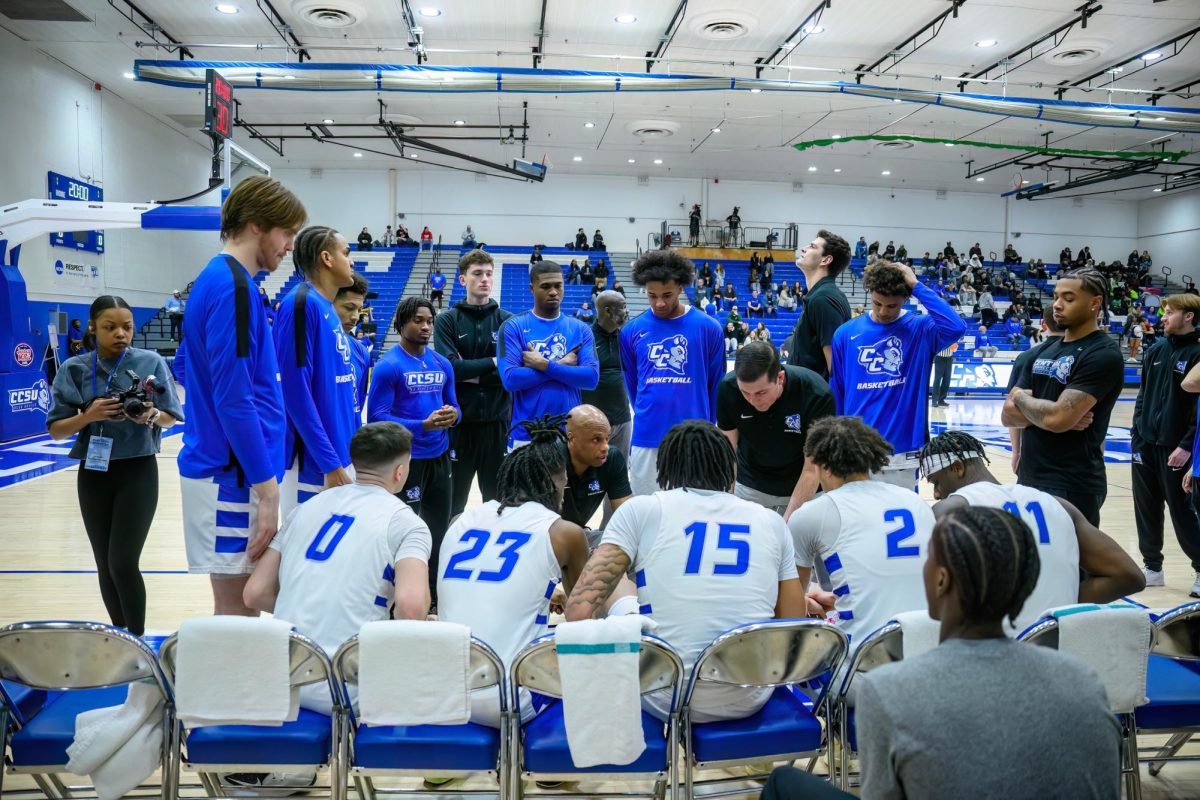 Patrick Sellers talking to Jordan Jones (23), Devin Haid (2) and the Blue Devils during a timeout