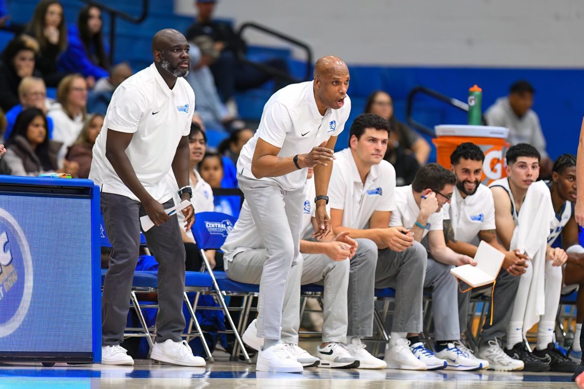 Coach Sellers (center) instructing his team