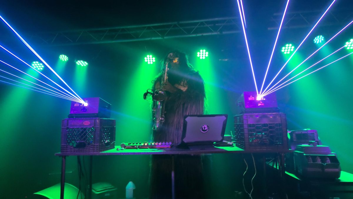 Saxsquatch plays during his live set and laser show in Hamden