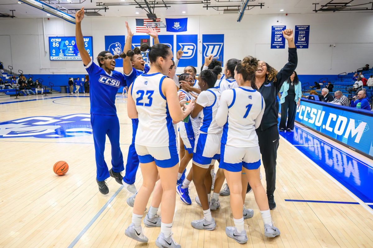 The Blue Devils celebrate their first win of the season on Senior Day