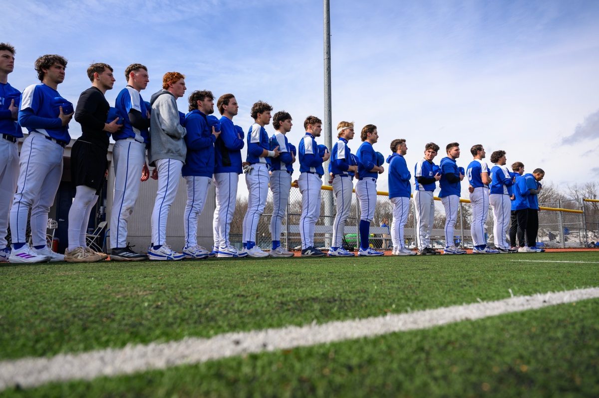 The Blue Devils standing for the National Anthem ahead of their game